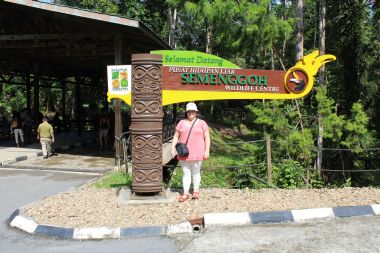 Mel In Front of the Sanctuary Sign