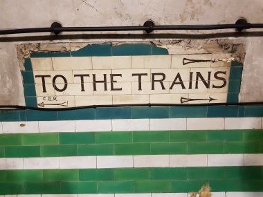 "To the Trains" Sign